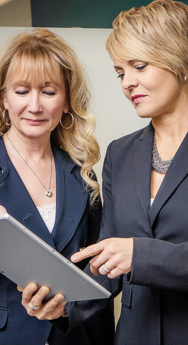 Business women looking at tablet