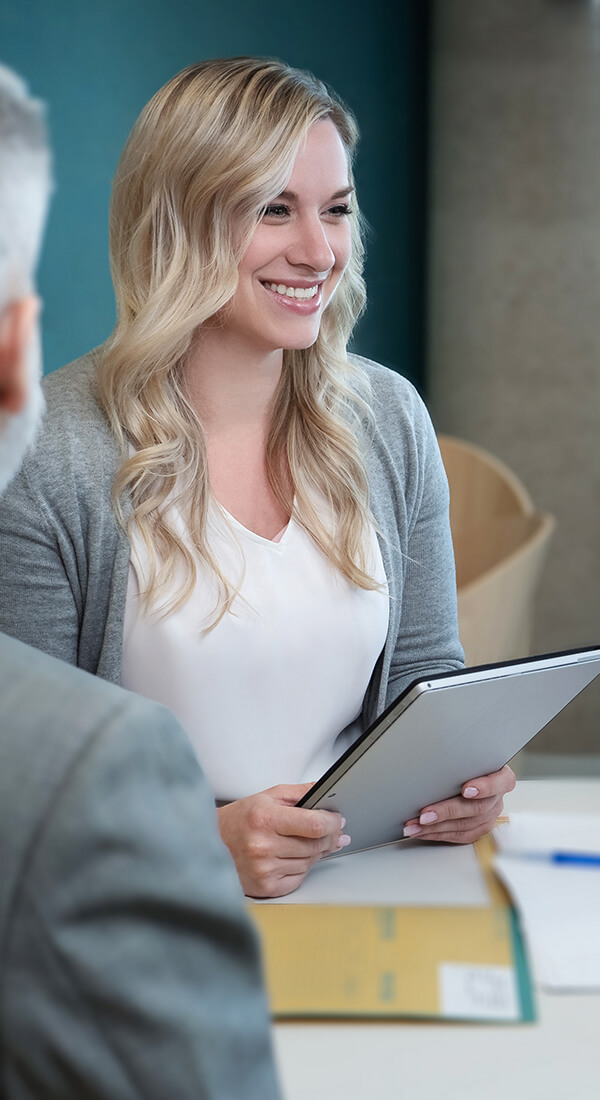 Woman smiling at table